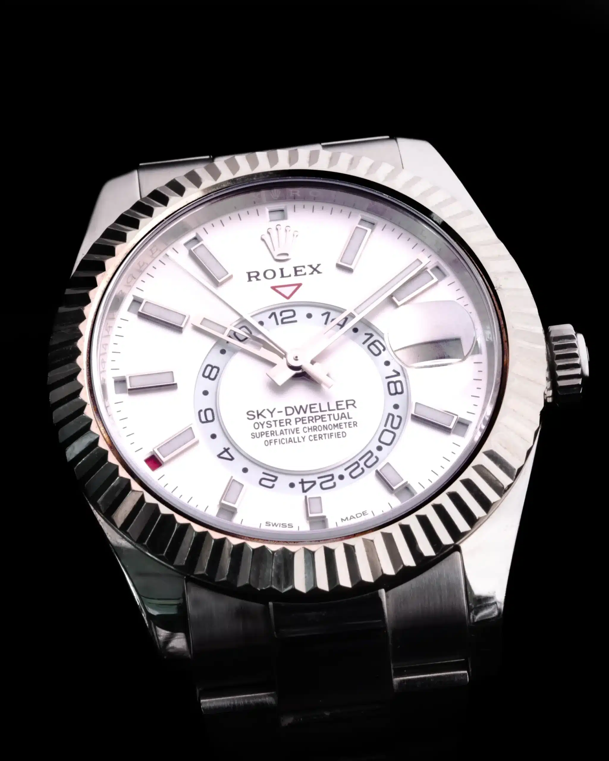 a sky dweller Rolex watch with a white face