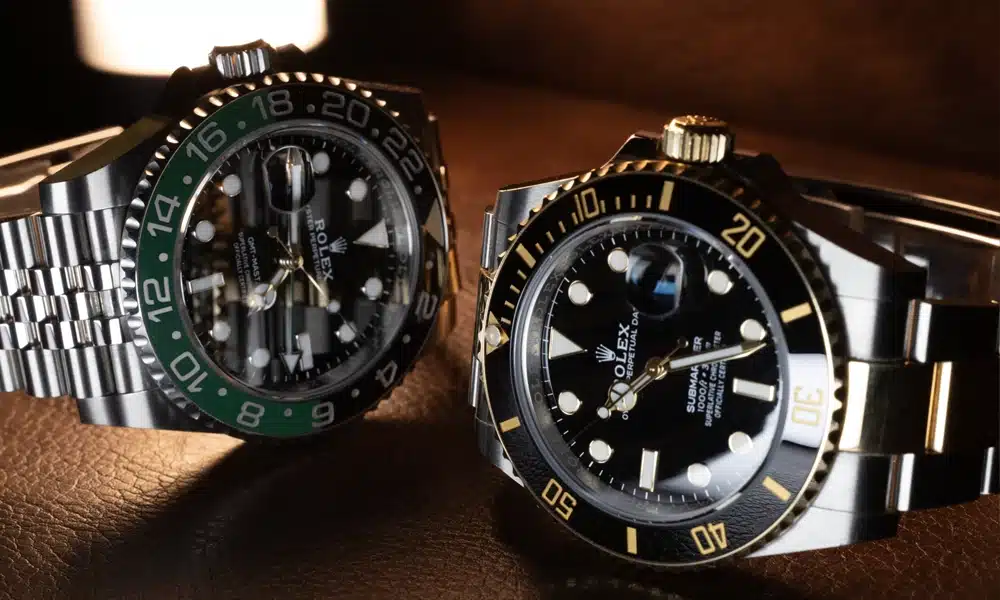 a couple of watches on a table